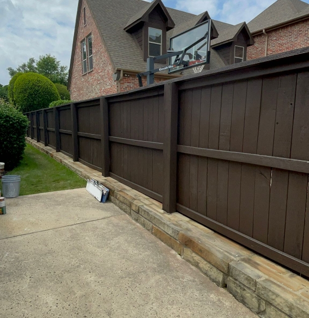 Residential brick house with privacy fence